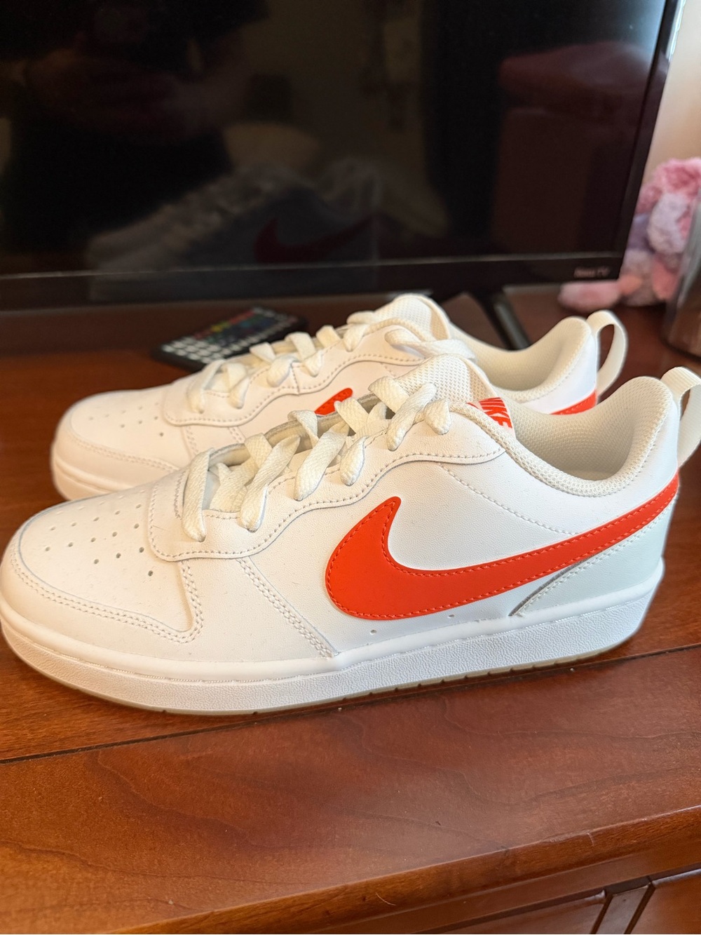 Nike Kids White Sneakers with Bright Orange Swoosh